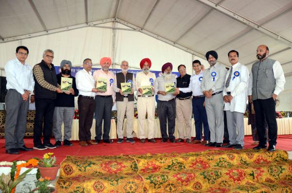 Dignitaries releasing Book in Pashu palan Mela on Dated 25-03-2023